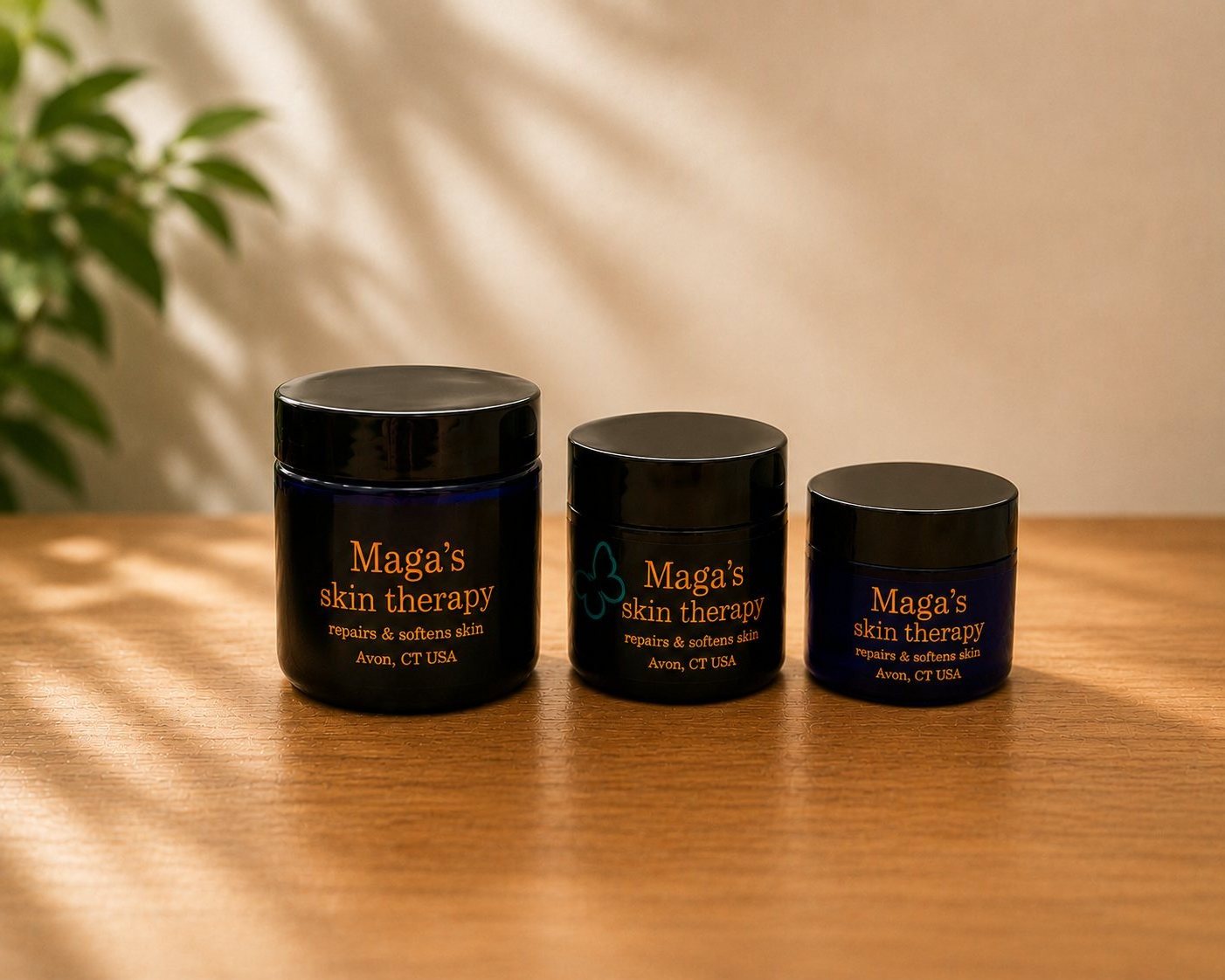 Three sizes of Maga's Skin Therapy jars side by side: 1 oz, 2 oz, and 4 oz